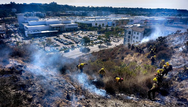 Fire risk and strong winds persist in Southern California, with the possibility of rain on the horizon